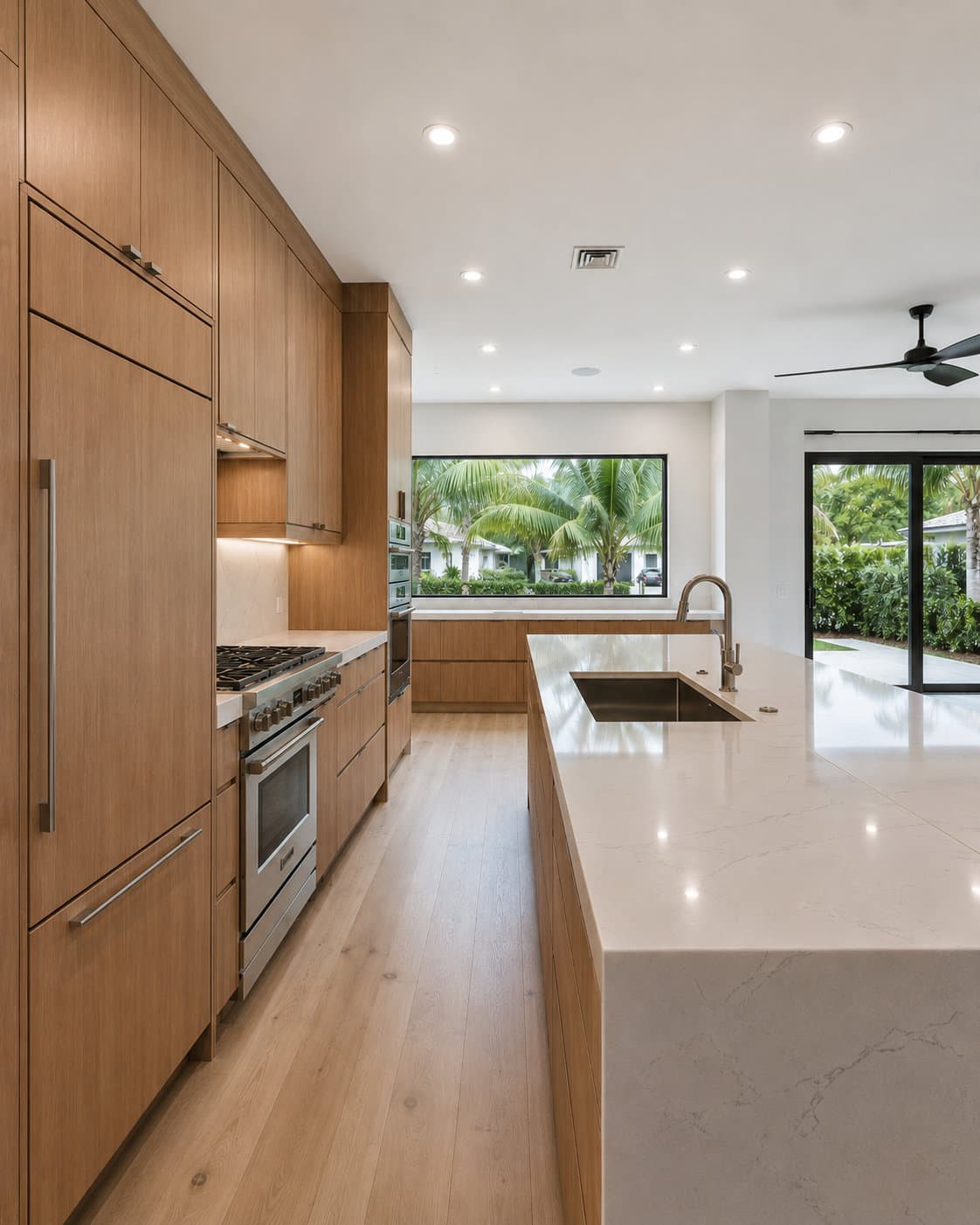 Tier 02 Miami kitchen panel-ready refrigeration integrated with semi-custom cabinetry, counter-depth flush mount — Gaven Constructions