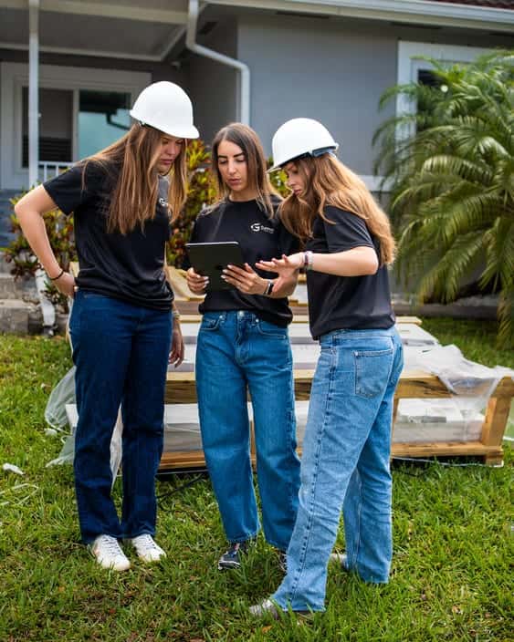 Gaven Constructions team members on-site at a Miami-Dade single-family project, reviewing project documentation
