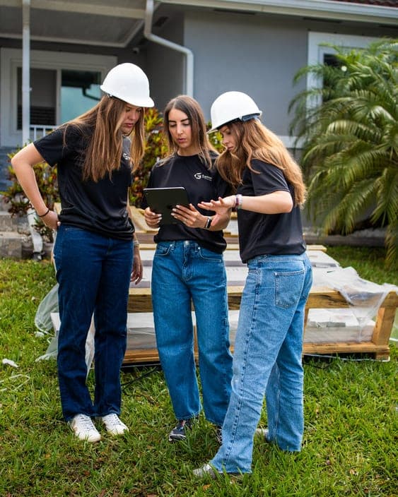 Gaven Constructions team members on-site at a Miami-Dade single-family project, reviewing project documentation