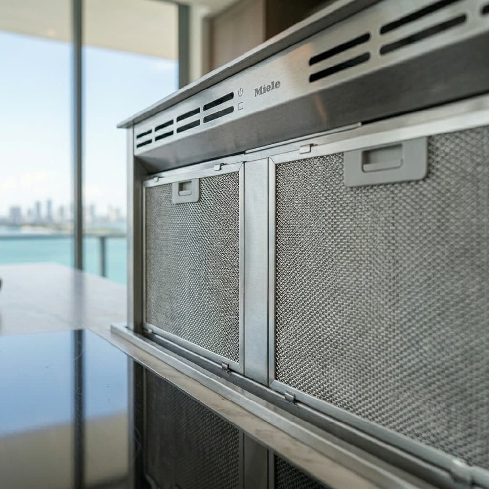 Completed suburban single-family kitchen — integrated hood with internal blower