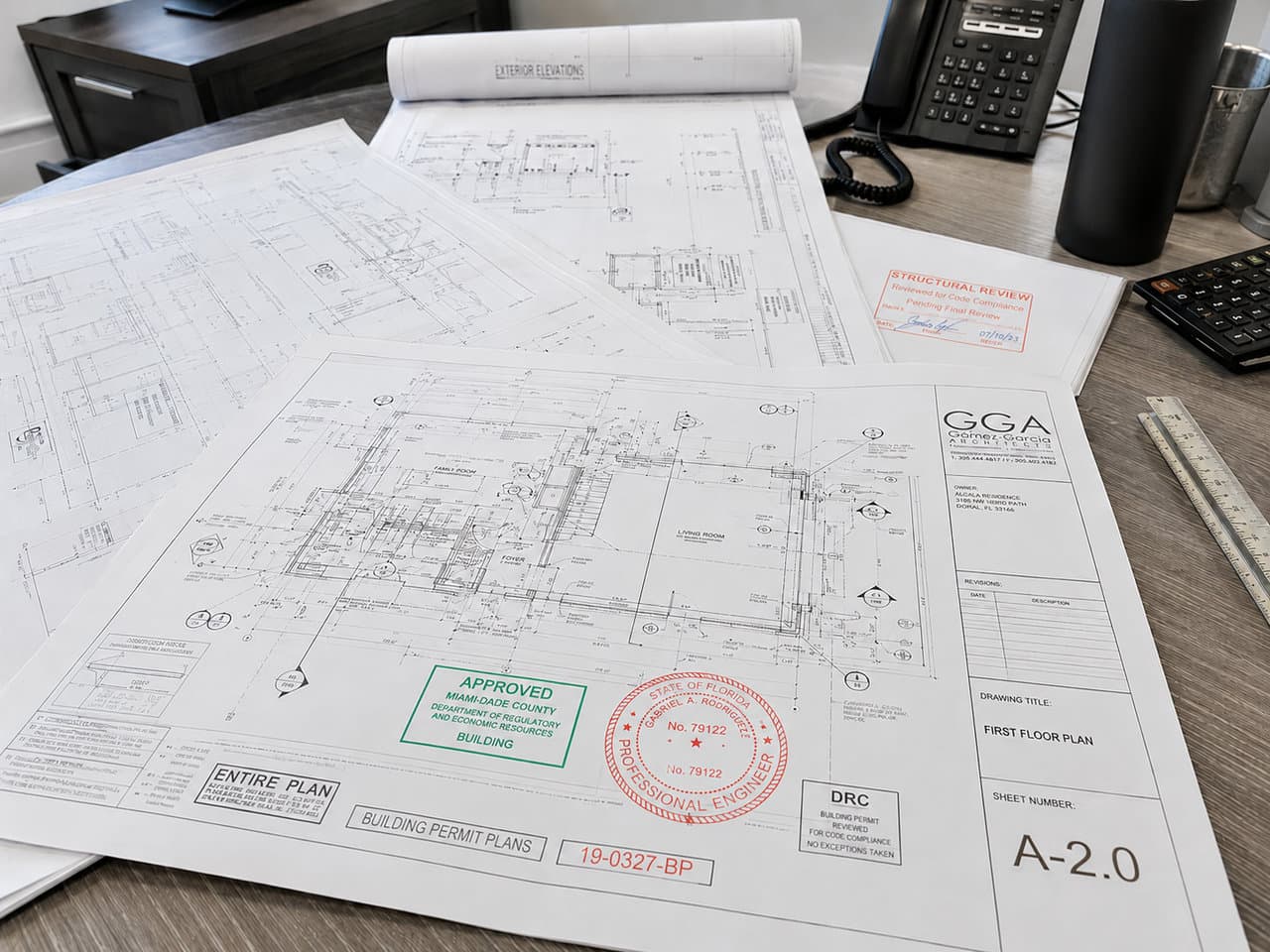 Approved Miami-Dade residential permit plan set with a green RER stamp and Florida engineer seal