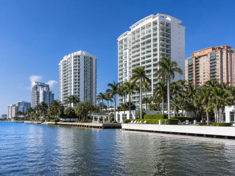 Williams Island private-island enclave waterfront with high-rise condominium tower stock on Maule Lake