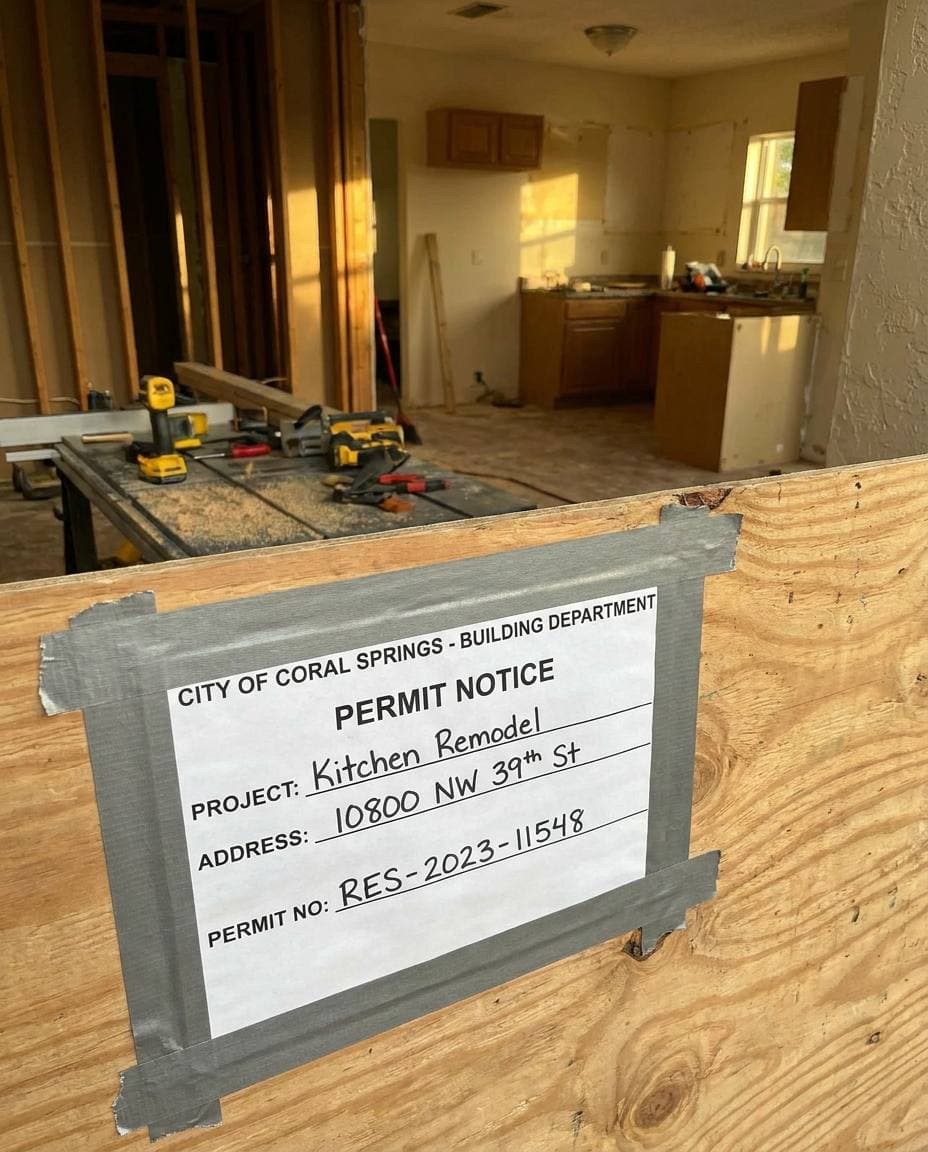 Posted City of Coral Springs Development Services building permit at active Gaven Constructions kitchen remodel jobsite