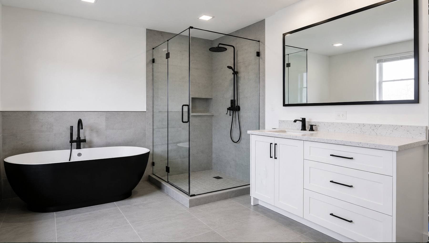 Completed bathroom remodel with a floating wood vanity and a freestanding soaking tub and a glass-enclosed walk-in shower