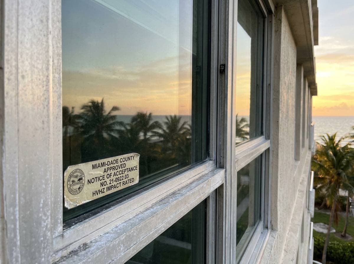 HVHZ-rated impact glass assembly with Miami-Dade Notice of Acceptance on Hillsboro Mile tower facade